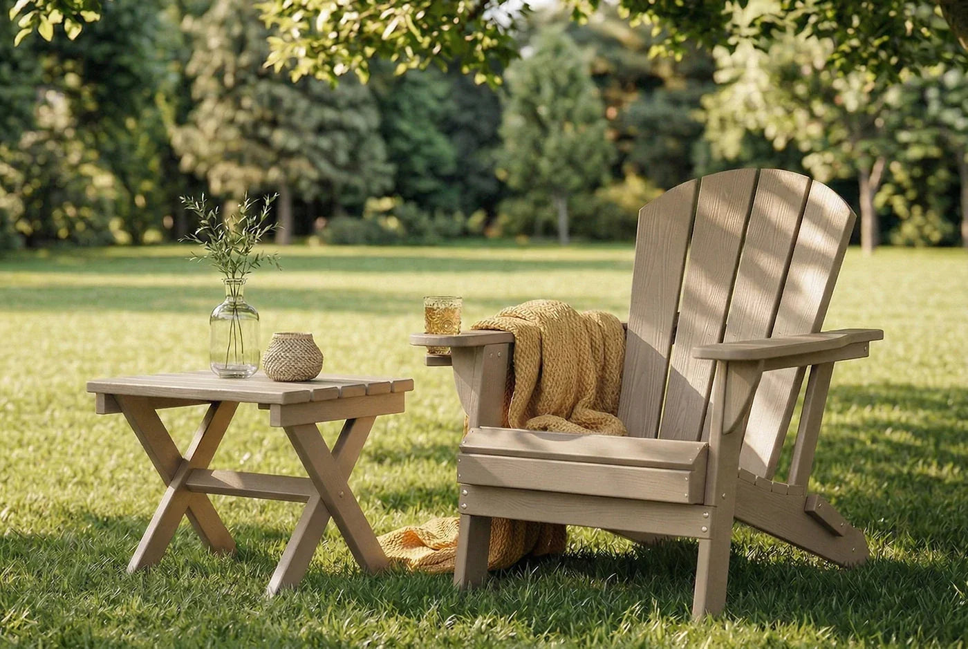 HDPE chair and table set on a grassy lawn with trees in the background