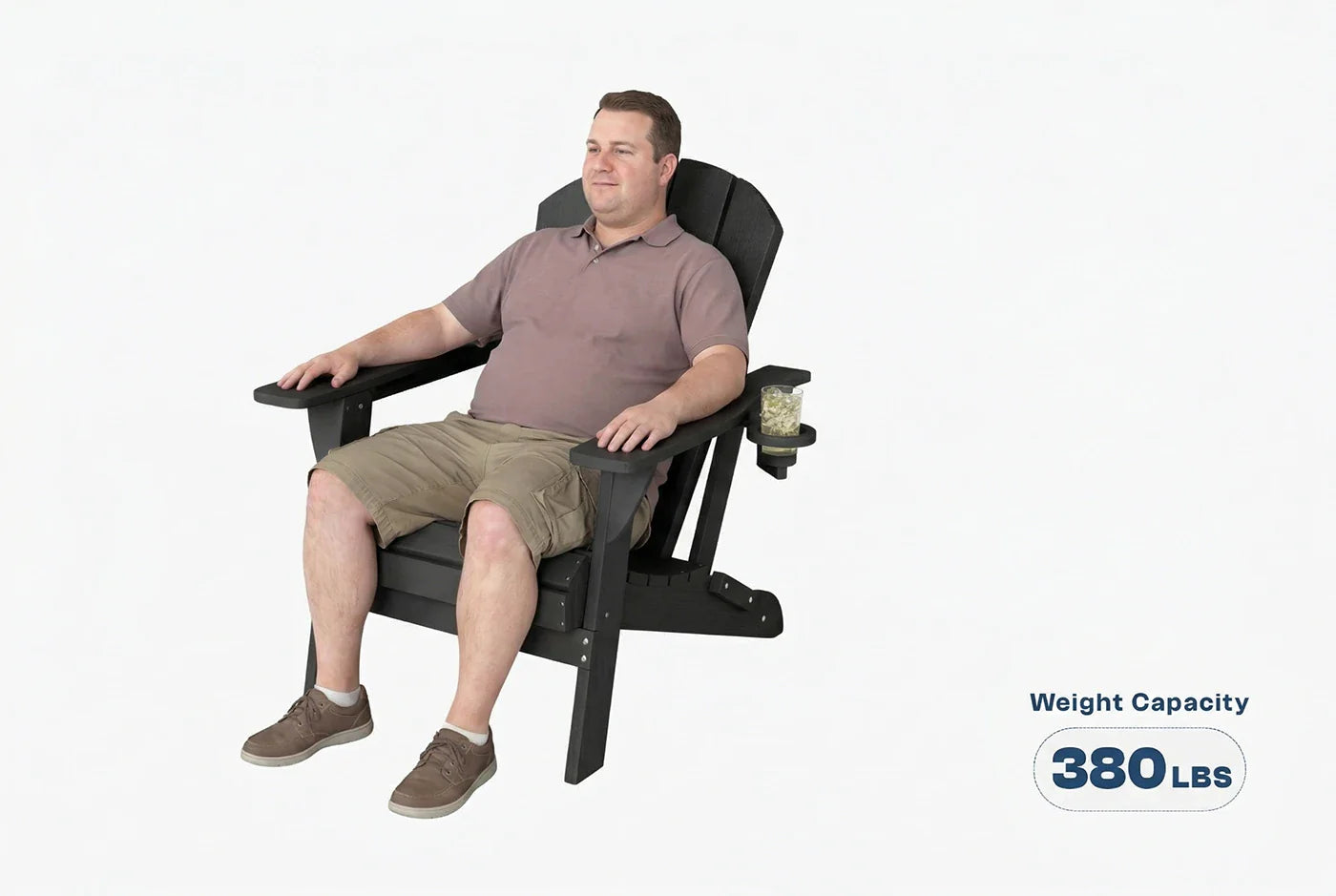Man sitting in a large black chair with a weight capacity label on a white background